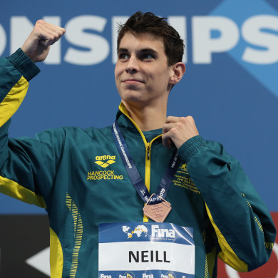 Neill claims his second medal of the meet to stand on the podium.